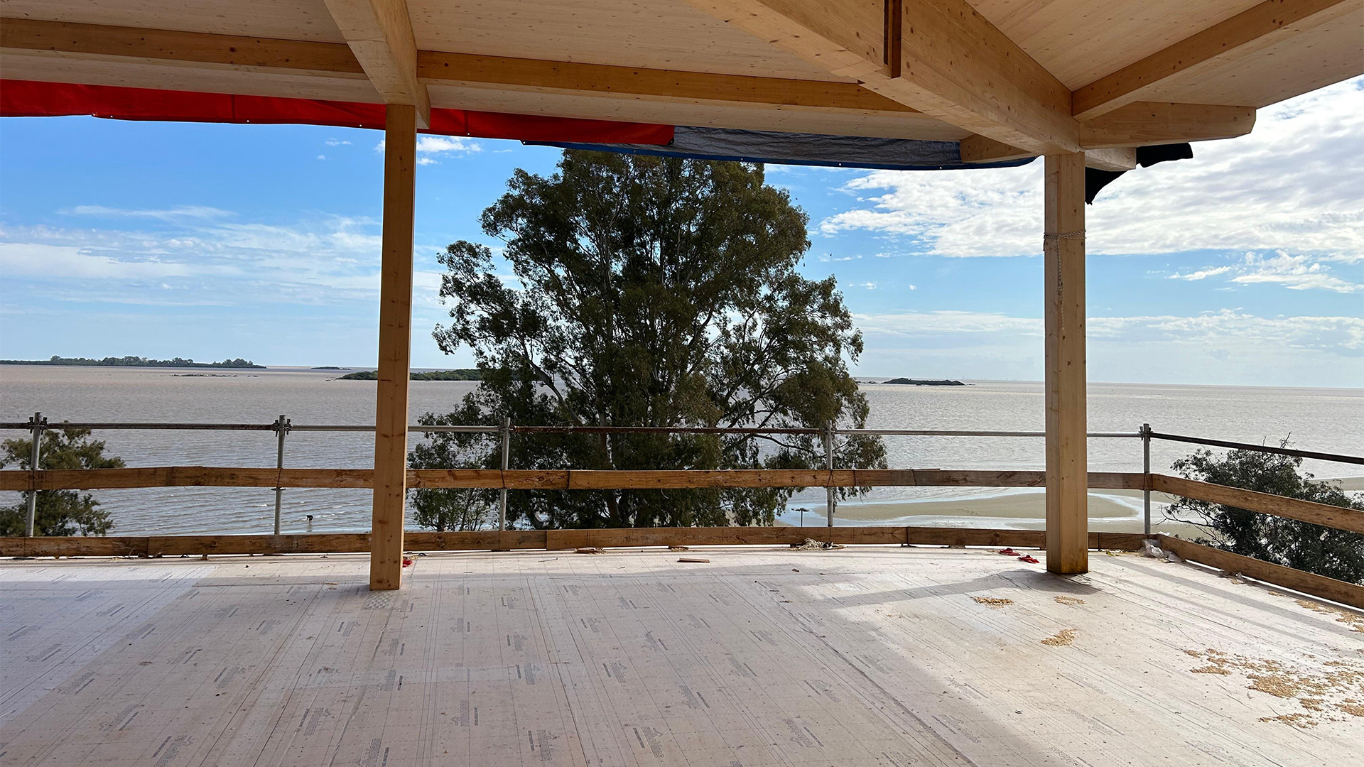 Mass timber structure under construction with CLT floor overlooking Río de la Plata, Uruguay